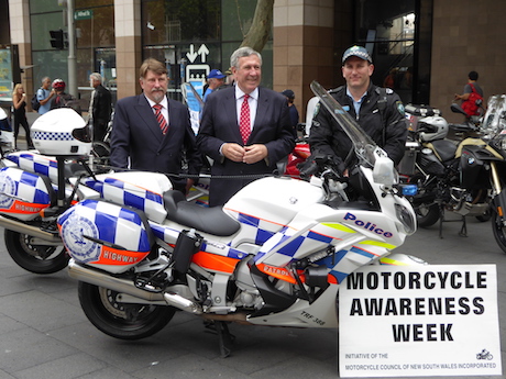 NSW MCC vice-chairman Chris Burns (left), NSW Transport Minister Duncan Gay and police officer - helmet legal issue