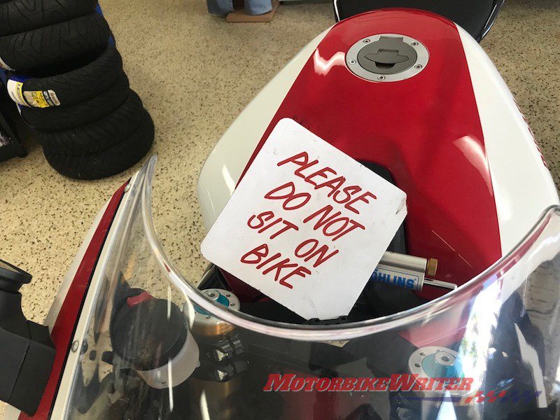 Please do not sit on motorcycle