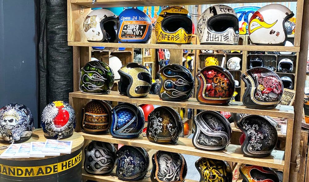 A collection of custom helmets from EICMA 2019 displays.