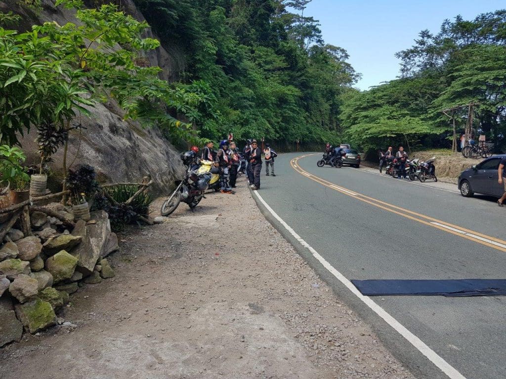 bikers parked on the side of the road