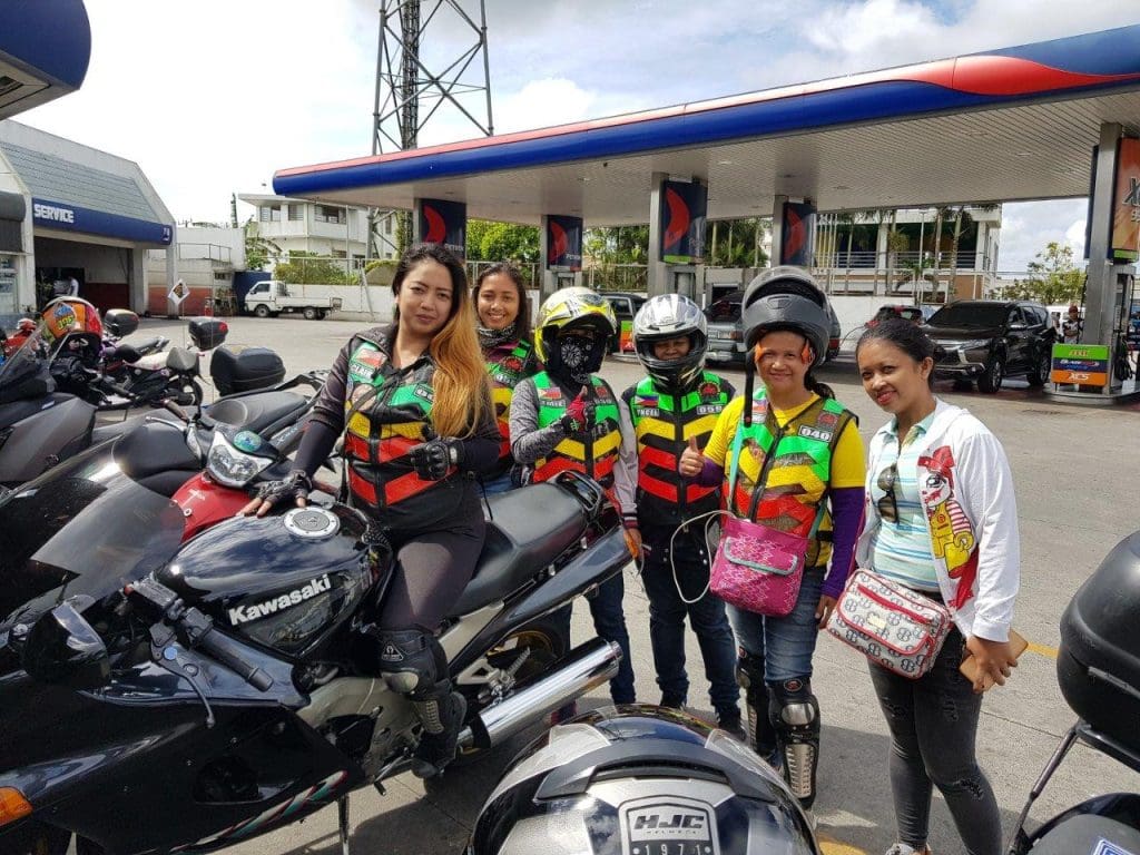 a group of lady bikers posing for a picture