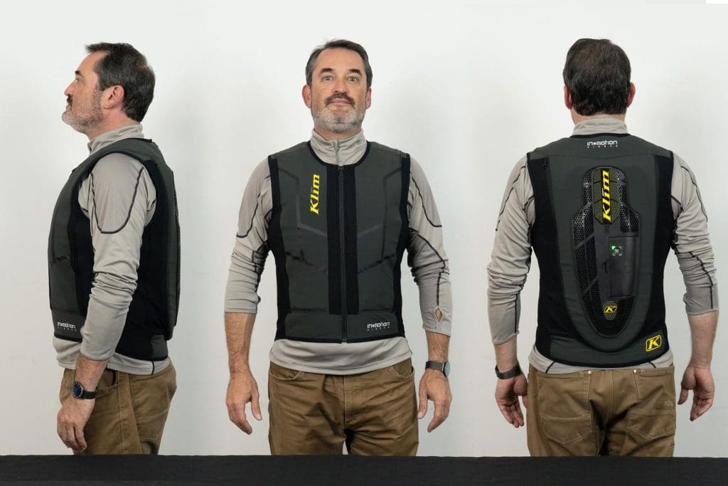 Front, side, and rear view of user wearing Klim Ai-1 airbag vest