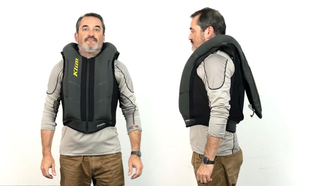 Front and side view of user wearing inflated Klim Ai-1 airbag vest
