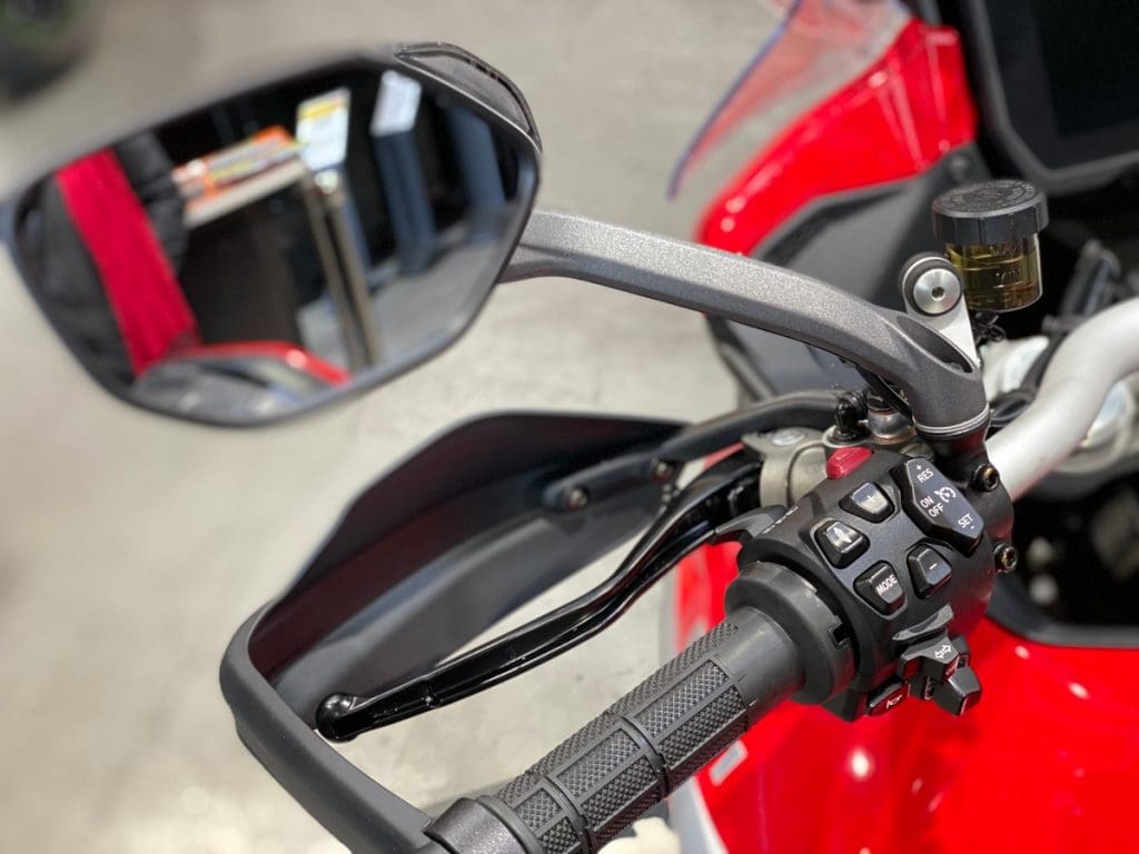 The mirrors on the 2021 Ducati Multistrada V4S have small yellow lights used by the radar system on board.
