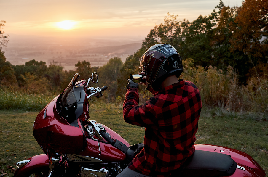 an Indian Motorcycle rider enjoying a sunrise/sunset