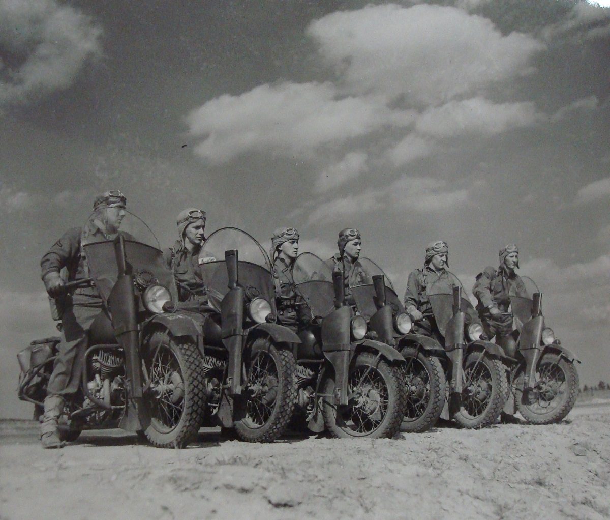 a lineup of military soldiers using the Harley Davidson WLA model