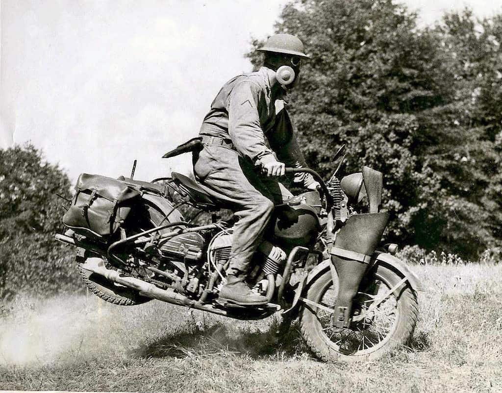 a view of a military motorcyclist performing a stunt