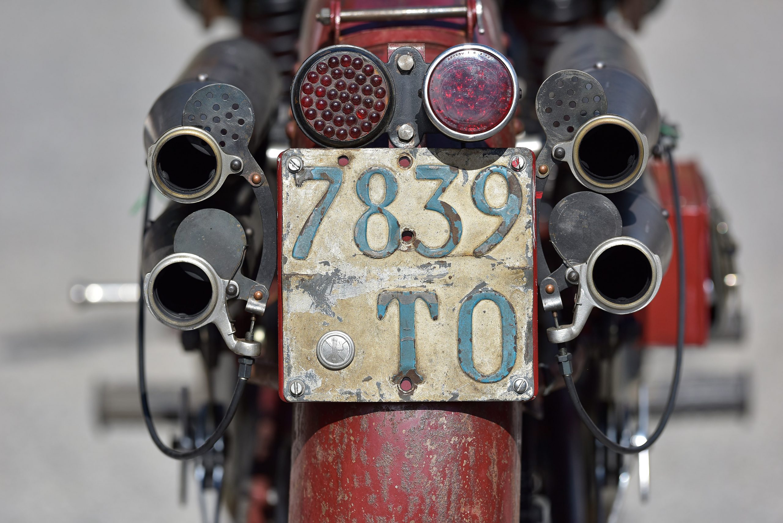 a view of the back licenses plate of a vintage bike