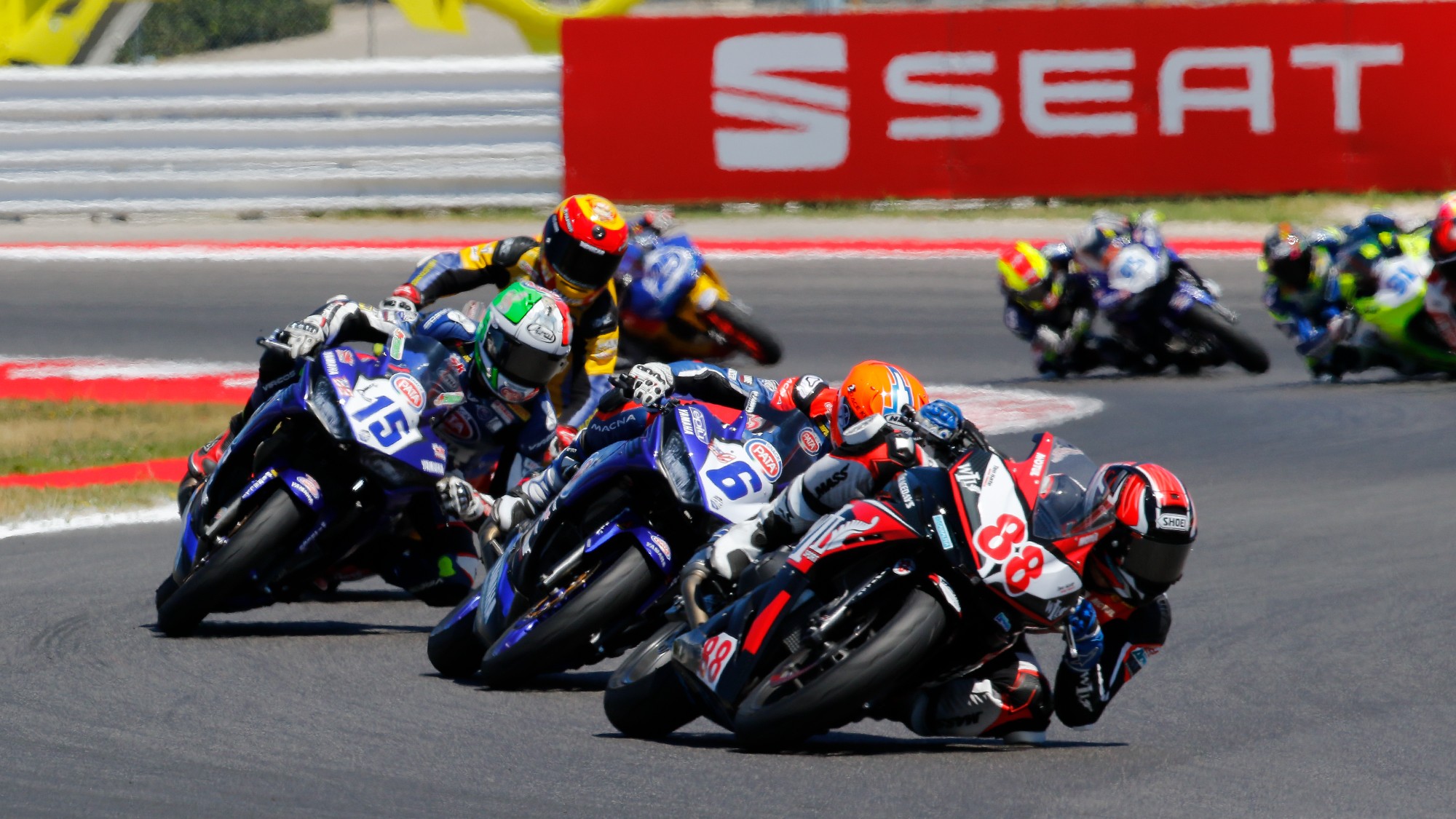 WorldSSP300: A lineup of riders leaning into the twisties