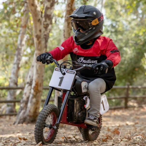 a young rider trying out the new sFTR Mini motorcycle from Indian Motorcycles - an electric-youth bike available to the smaller riding community