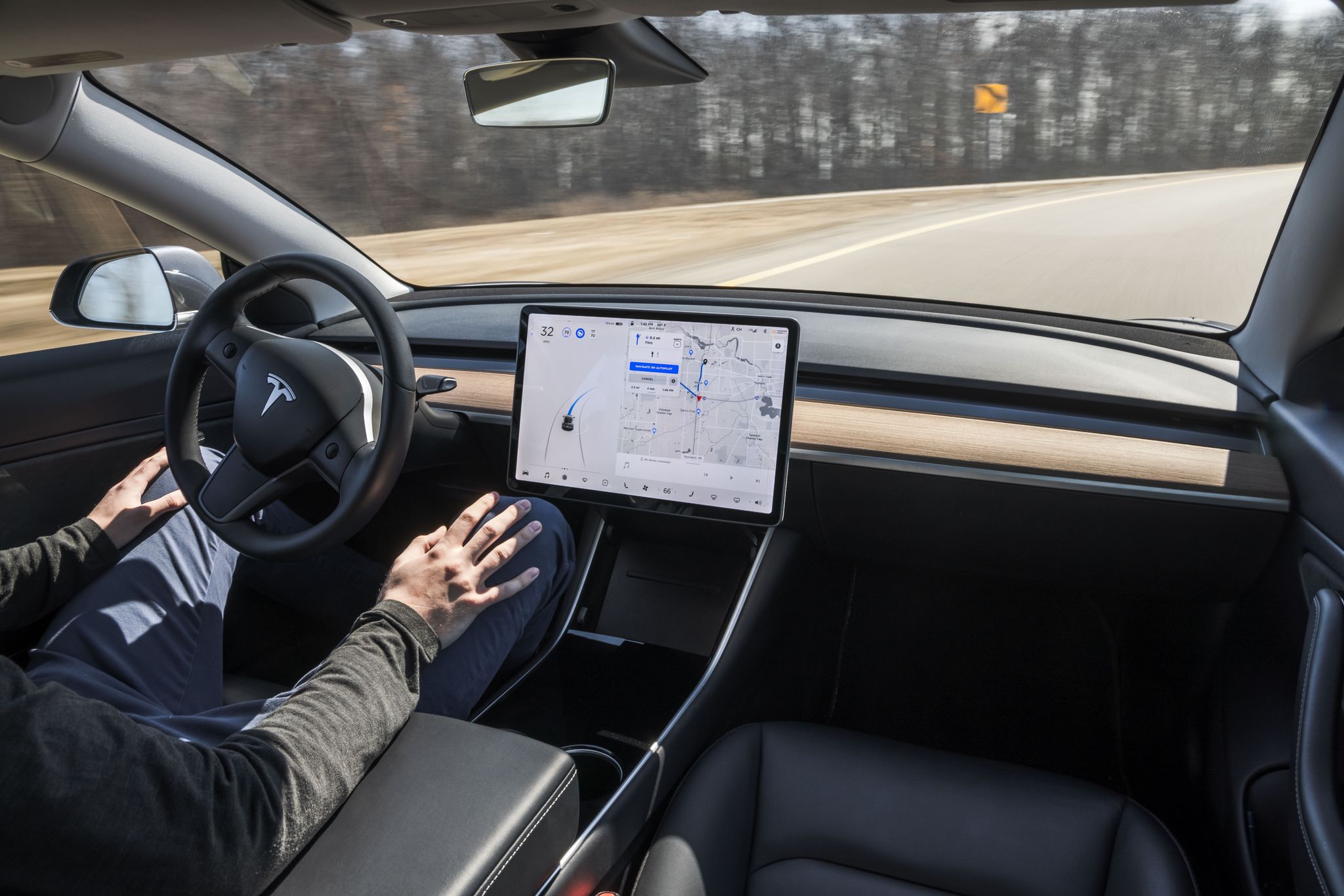 A view of the driving cockpit of a Tesla car, proven to be capable of full autonomy as of 2020