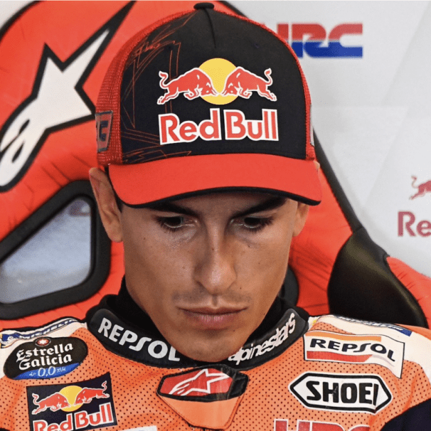 Marc Marquez looks down during a press conference.