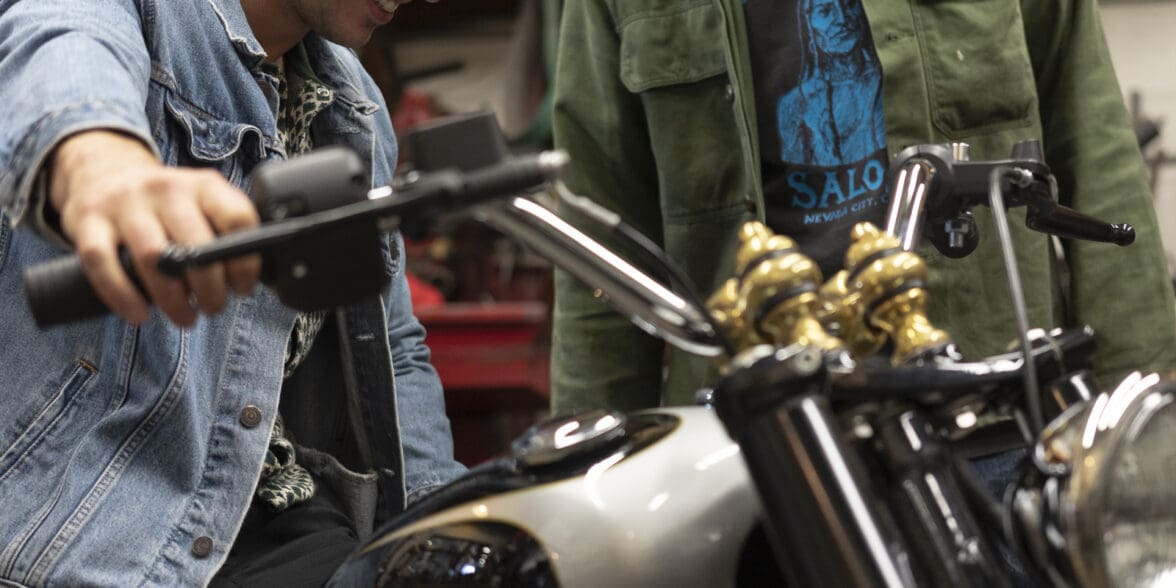 Gō Takamine with Nicolas Hoult next to the new Brat Style bobber from Inaidn Motorcycles that Takamine modded out for the movie star