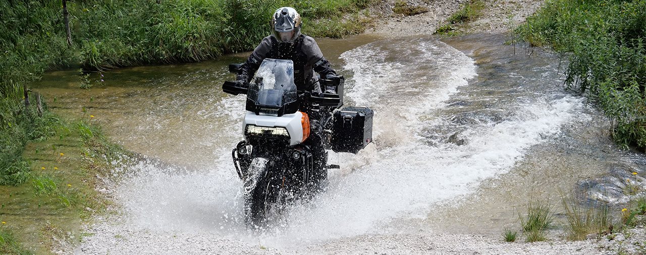 A view of a Harley-Davidson Pan America splashing through water