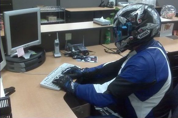 A view of a biker at the computer