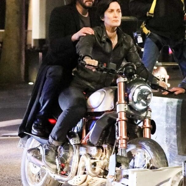 A view of Reeves and Carrie-Anne trying out a Ducati bike for the Matrix