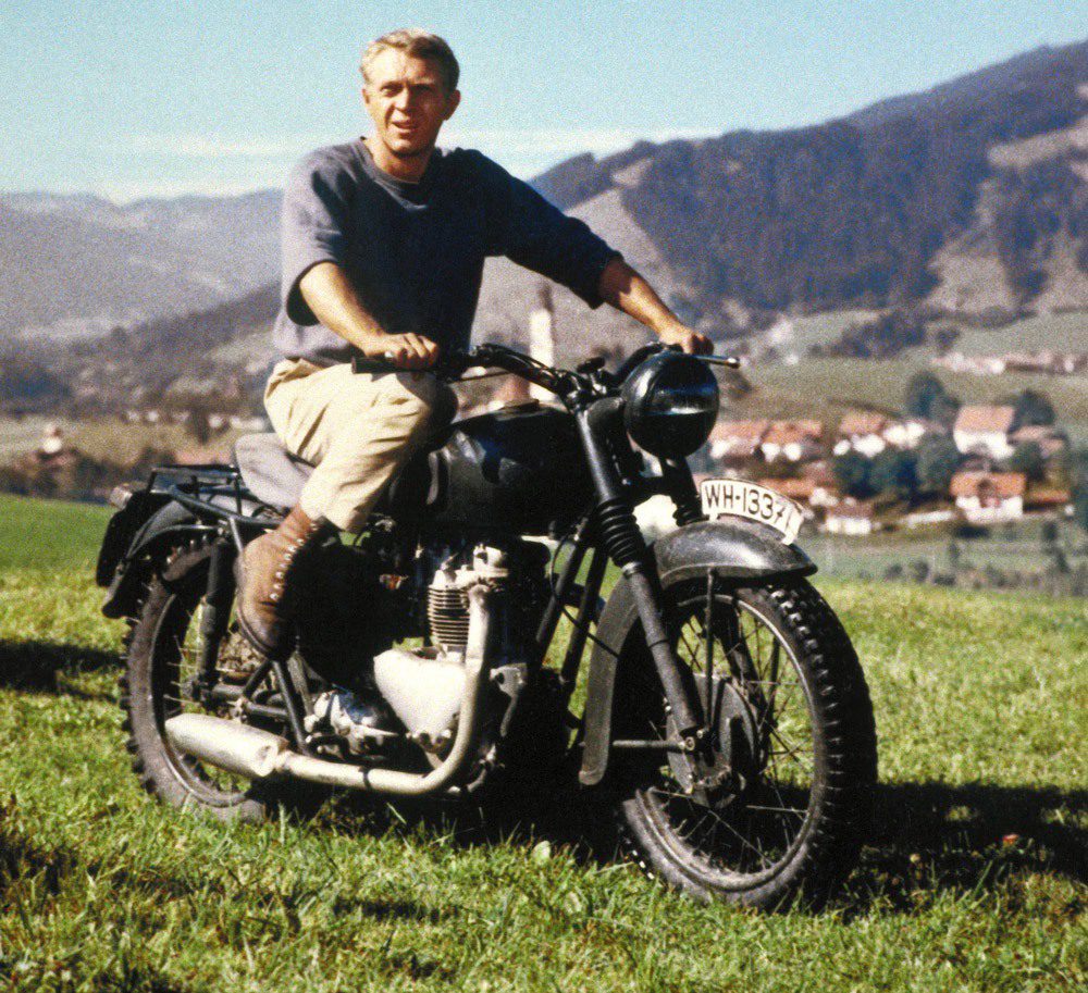 Steve McQueen on his Triumph TR6 motorcycle while filming The Great Escape movie in 1963