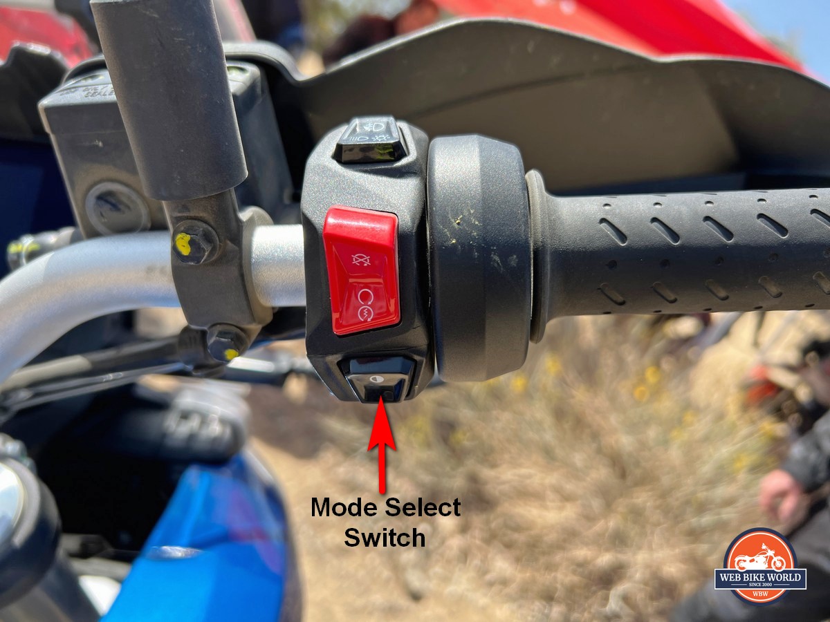 The mode select switch is on the R bar housing of the Aprilia Tuareg 660.