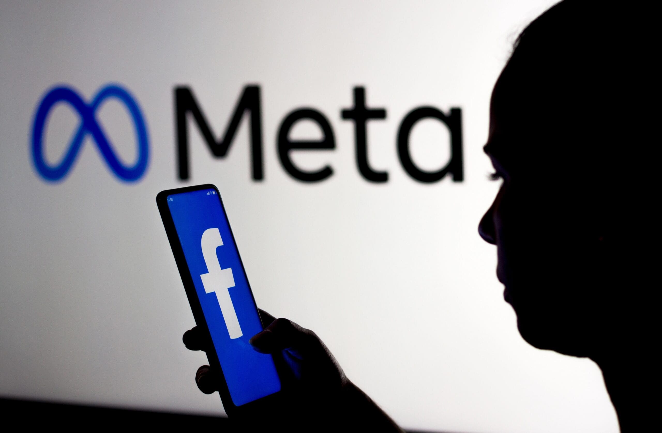A figure showing off a Facebook logo in front of a Meta logo. Media sourced from Fortune. 