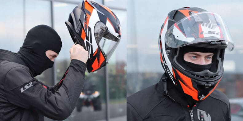 An image of a rider wearing a balaclava putting on his helmet.