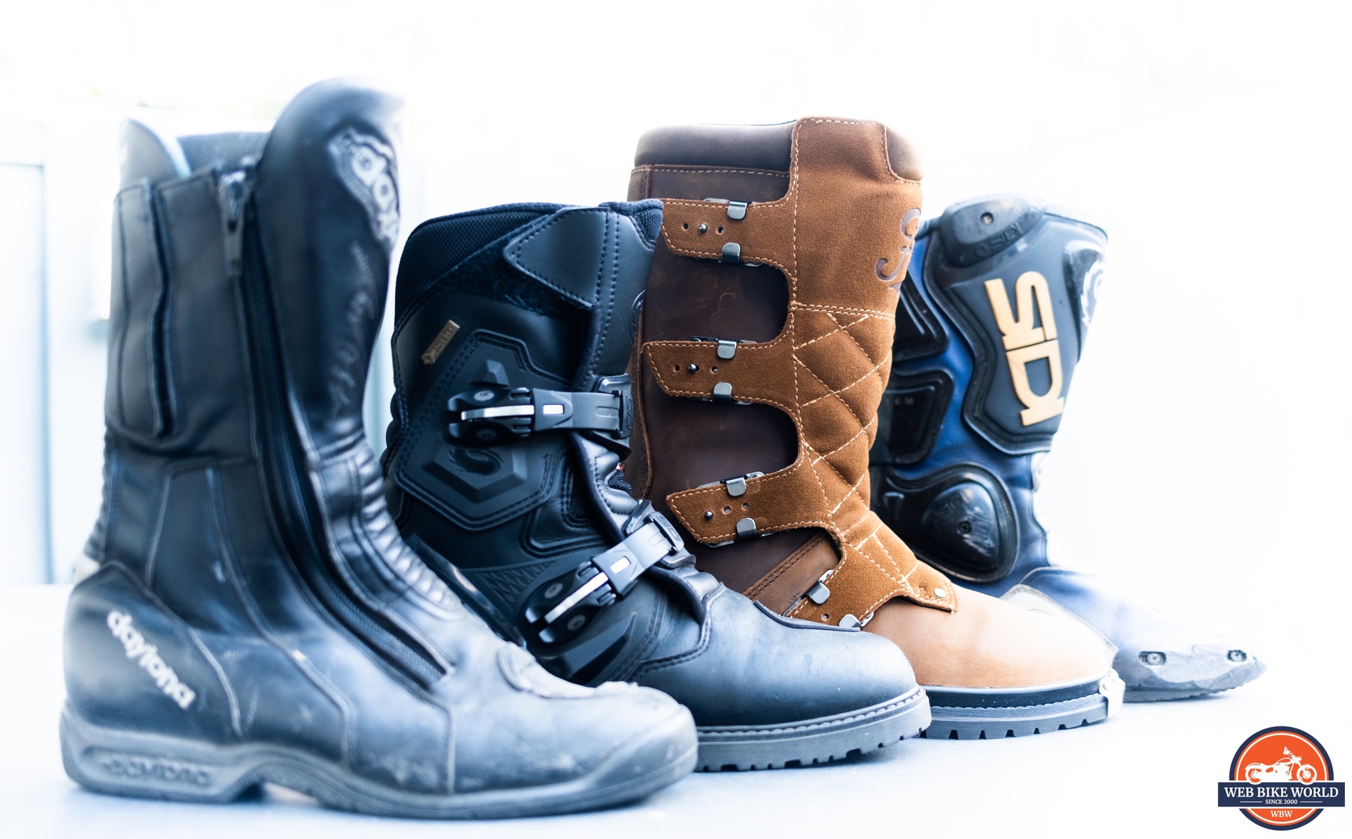 Side view of four different motorcycle boots including a Fuel Dust Devil Boot