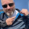 Author pointing to lining fabric in Klim Induction Jacket
