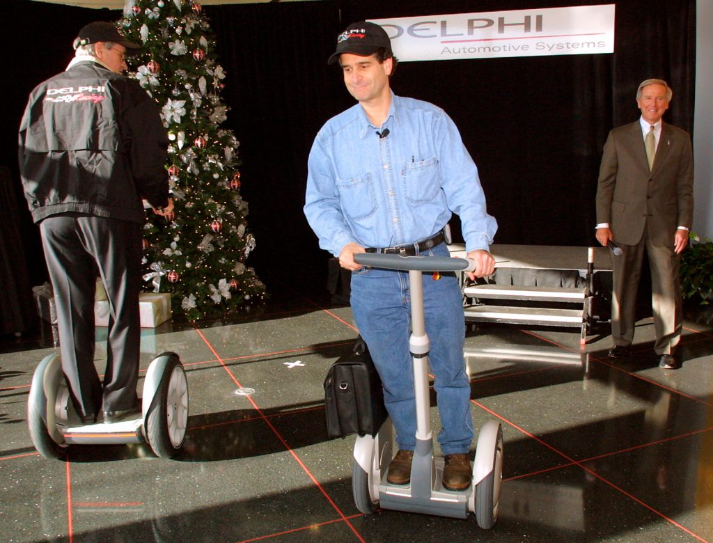 CEO Dean Kamen rides early Segway PT prototype