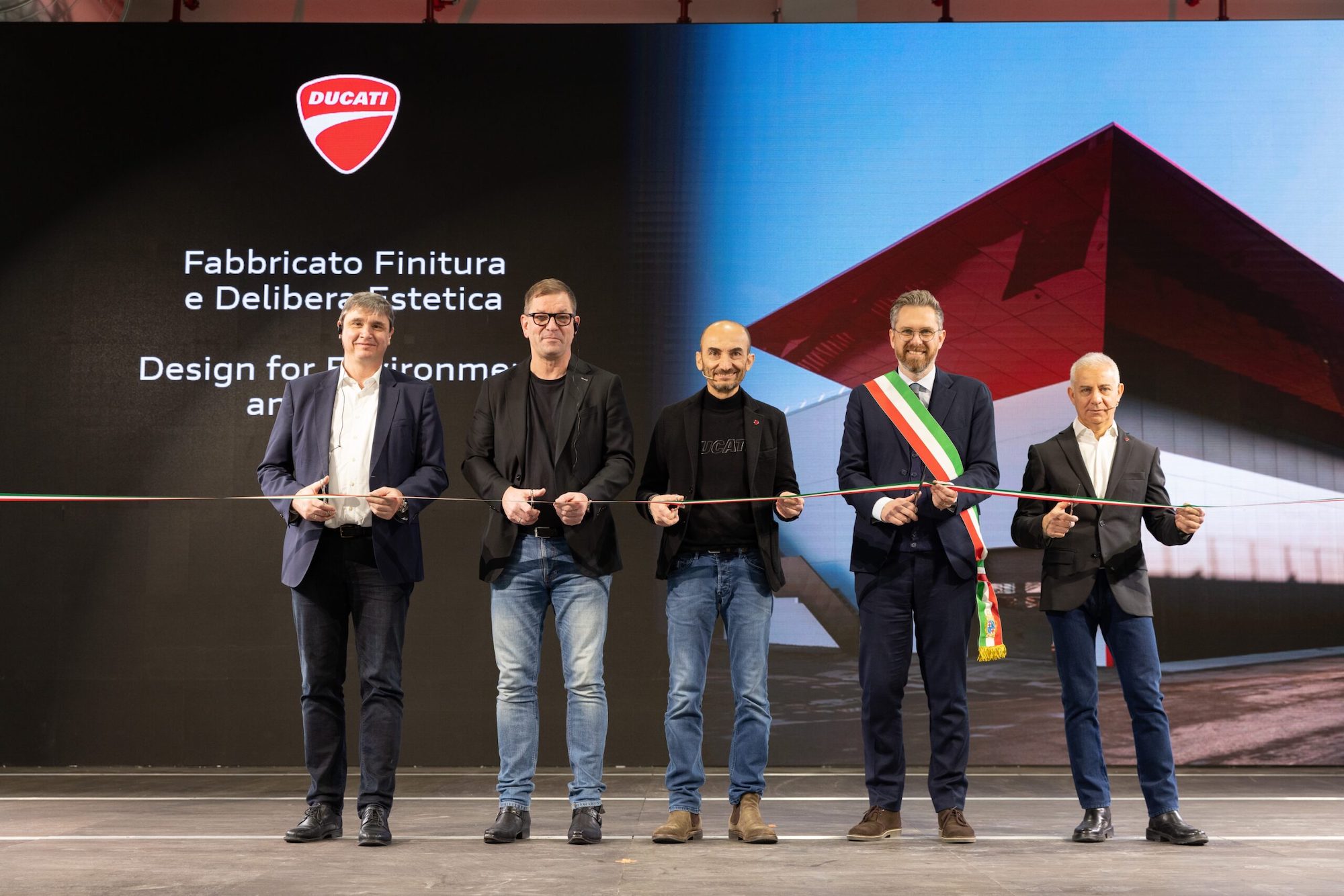Claudio Domenicali next to Bologna's mayor and other relevant persons of importance at Ducati's all-new eco-friendly building, the Finitura e Delibera Estetica. Media sourced from Motosan.