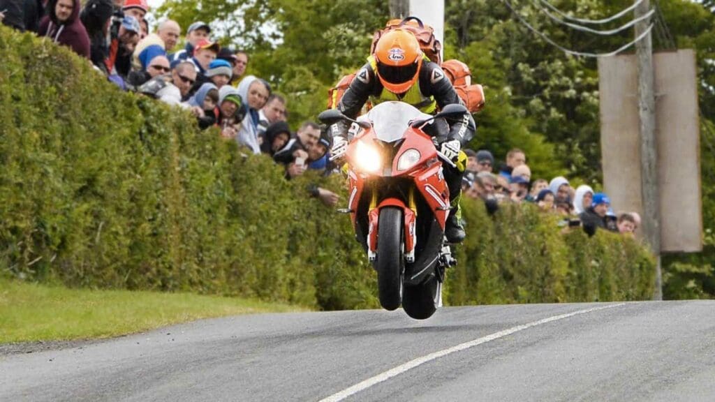 A racer from the Isle of Man, airborne as the need for speed remains top-tier. Media sourced from RideApart.