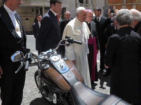Pope Francis with the Harley Dyna expensive motorcycle holy