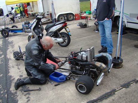 Trevor Duckworth with one o/f his three-wheelers wheelie