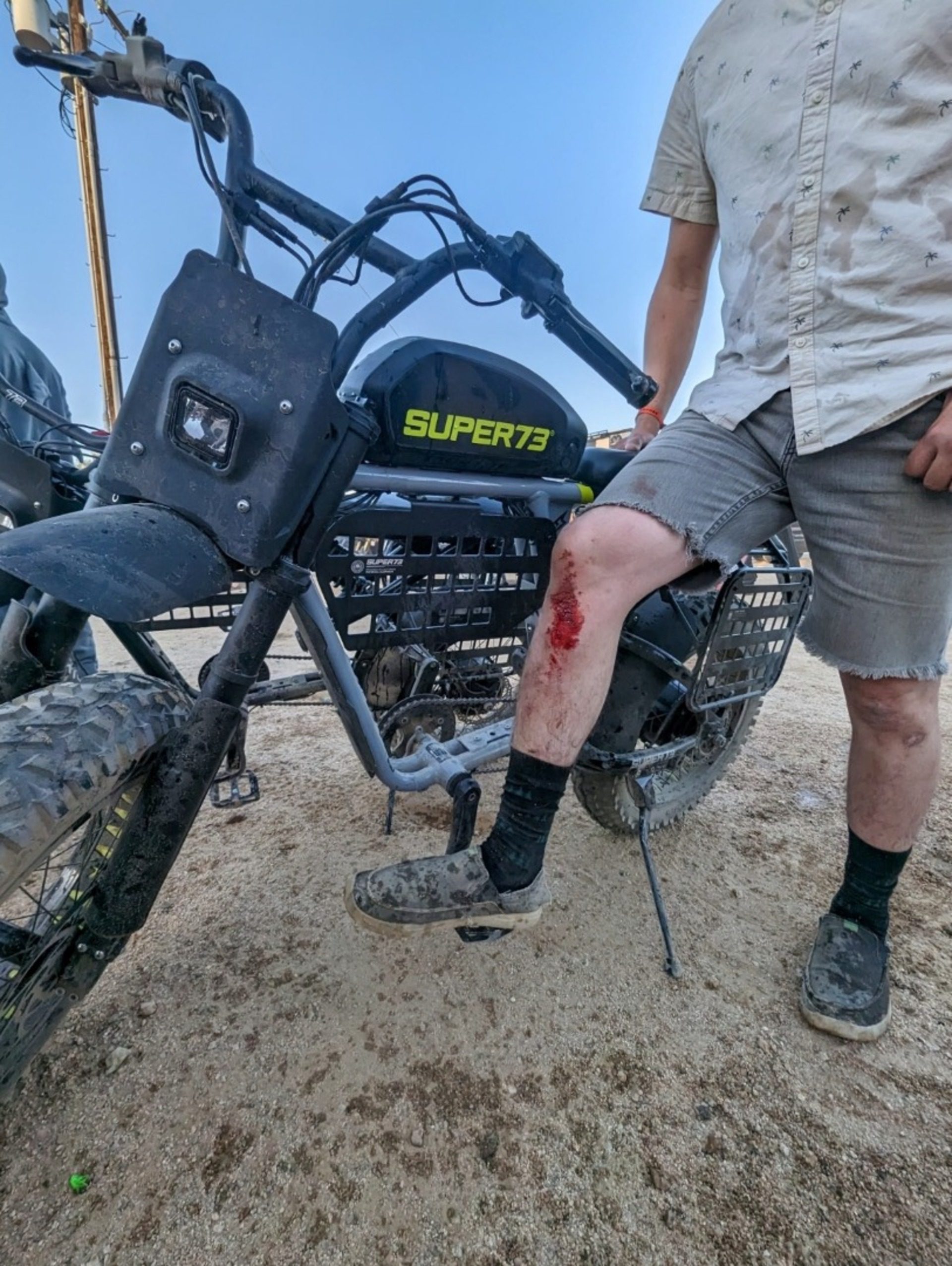 Rider standing next to Super73 electric bike