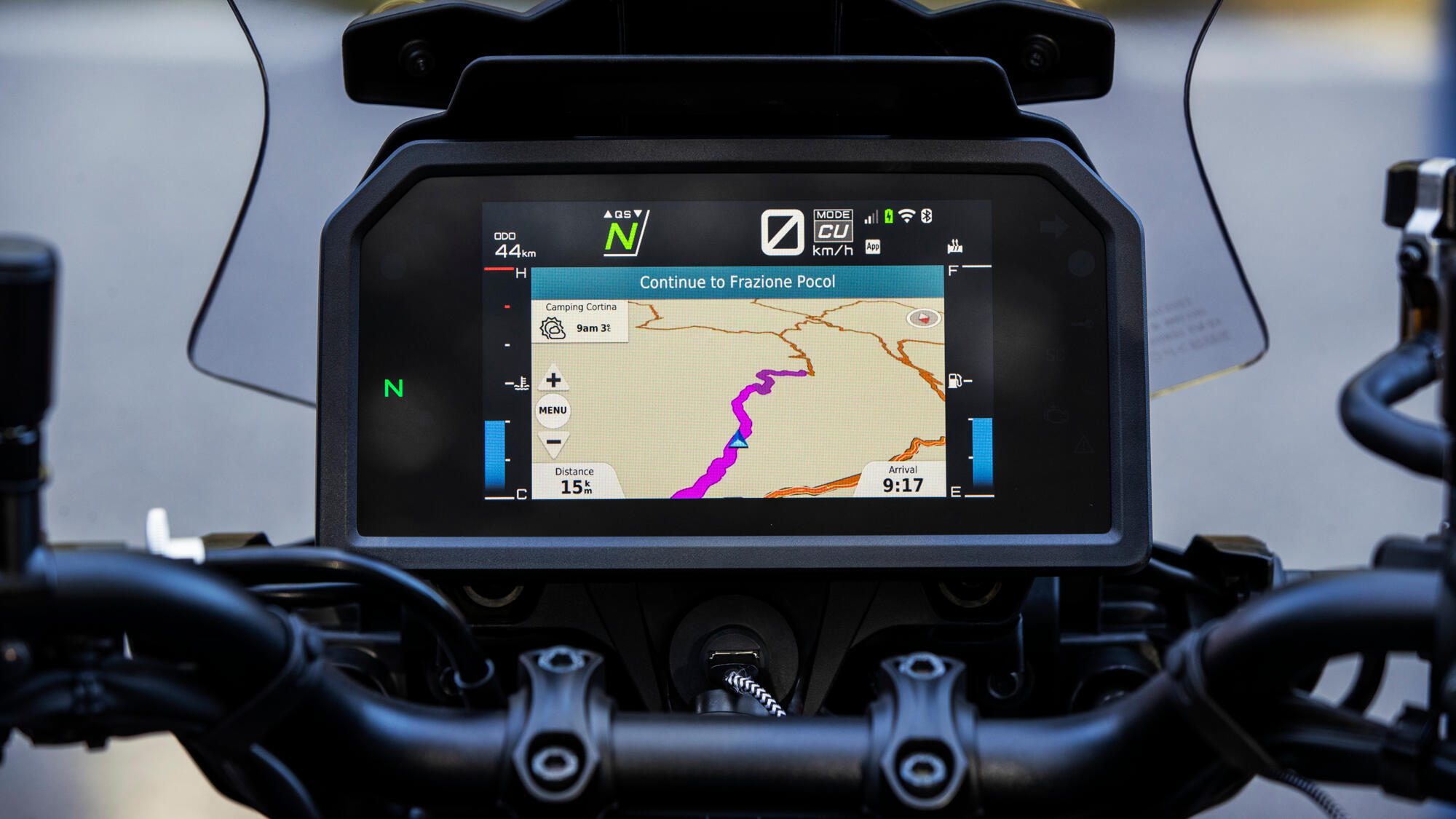 A detail shot of the dash of Yamaha's 2023 Tracer 9 GT motorcycle showing a GPS map