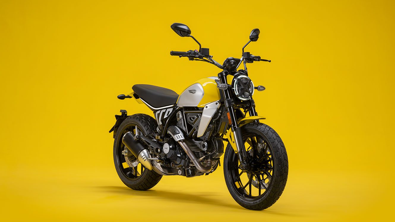 Ducati's "Scrambler" motorcycle on a yellow studio background