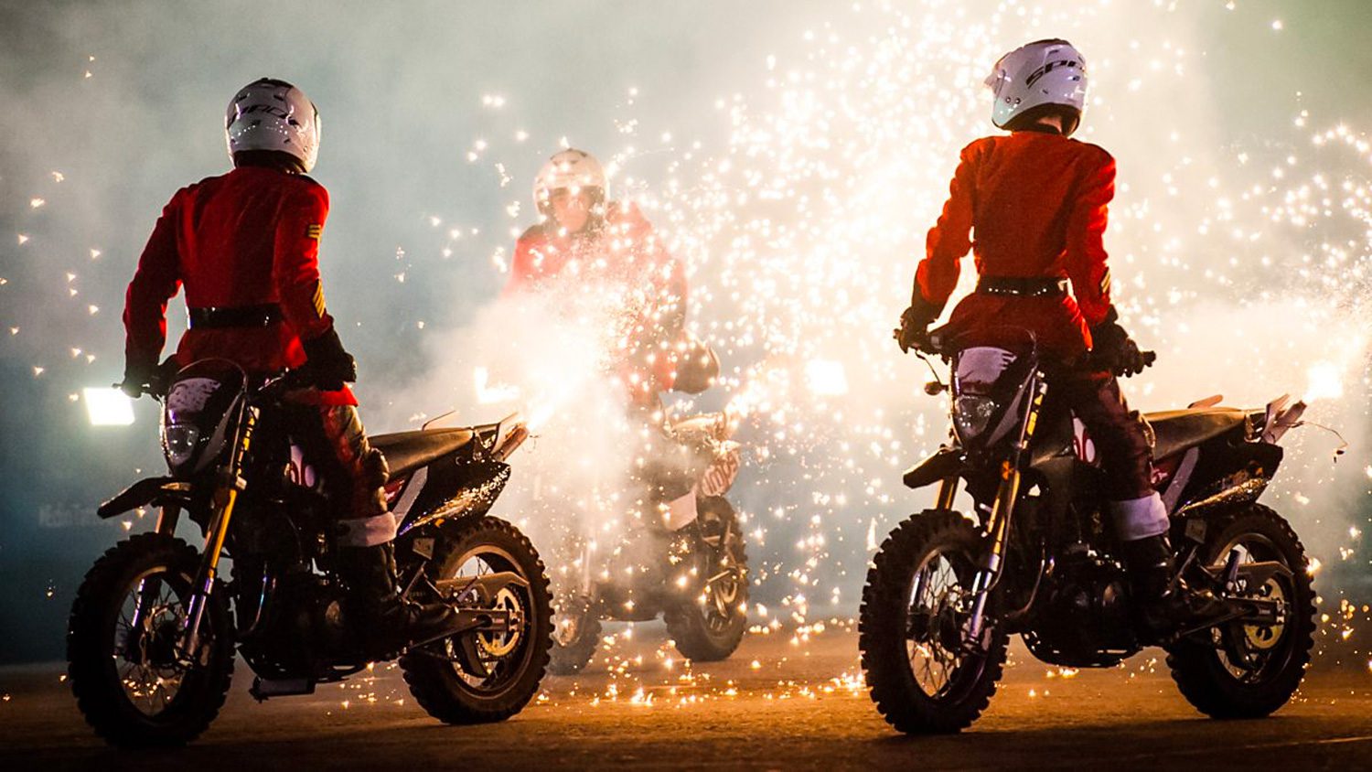 Army motorcyclists perform a wheelie motorcycles