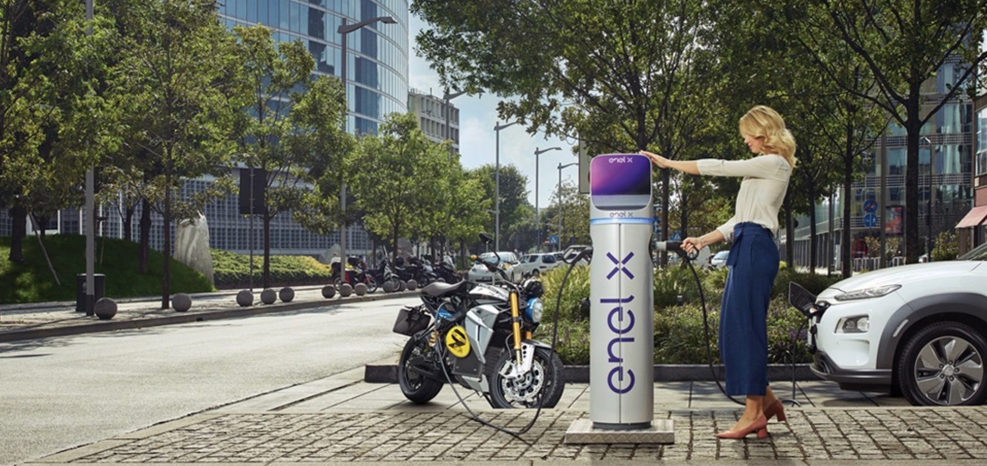 A view of an electric motorcycle charging up at a station in Italy. Media sourced from ENEL.