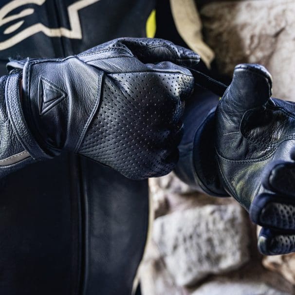 rider putting on Racer USA Verano Gloves