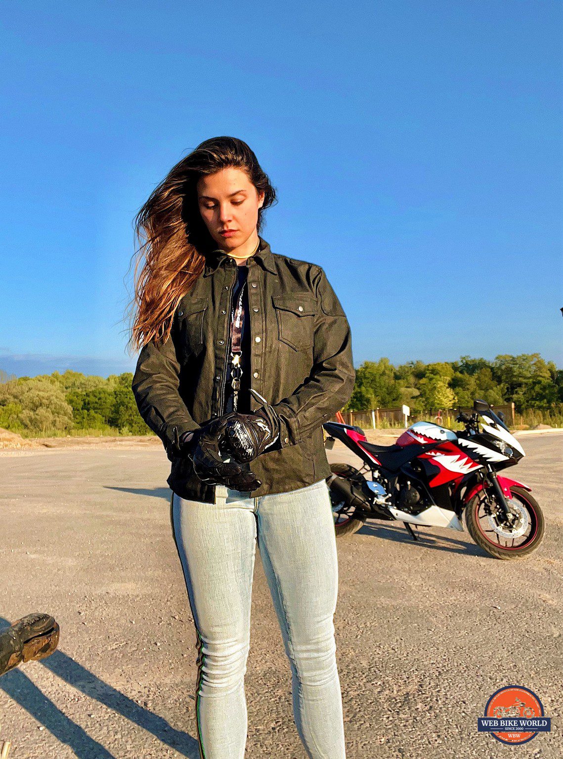 Rider wearing Scorpion EXO Women's Covert Wax Riding Shirt
