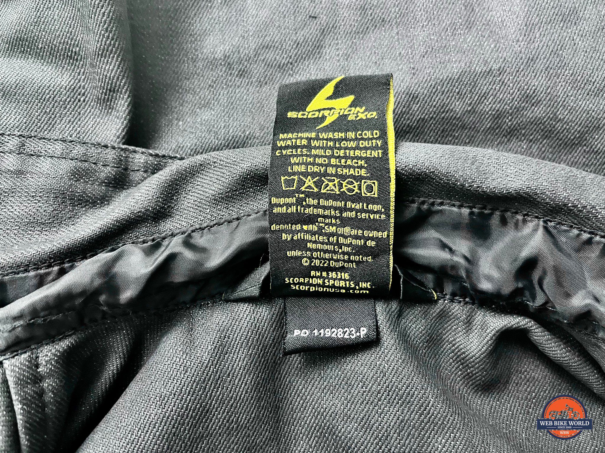 Care instructions tag on Scorpion EXO Women's Covert Wax Riding Shirt