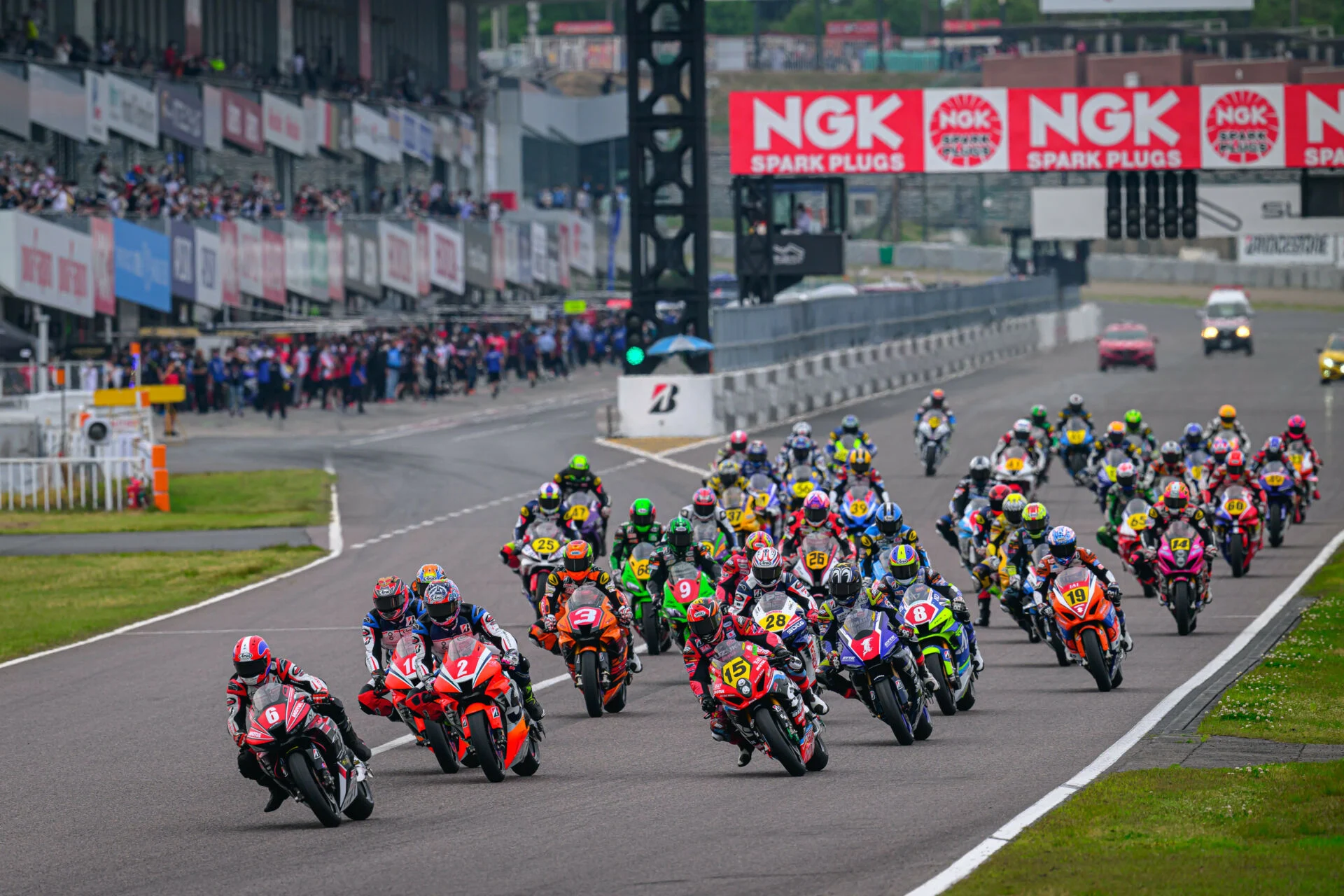 motorcycles racing at the suzuka circuit